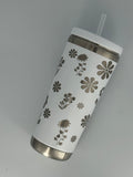 White stainless steel tumbler with laser-engraved floral design featuring daisies, sunflowers, and wildflowers, with lid and straw